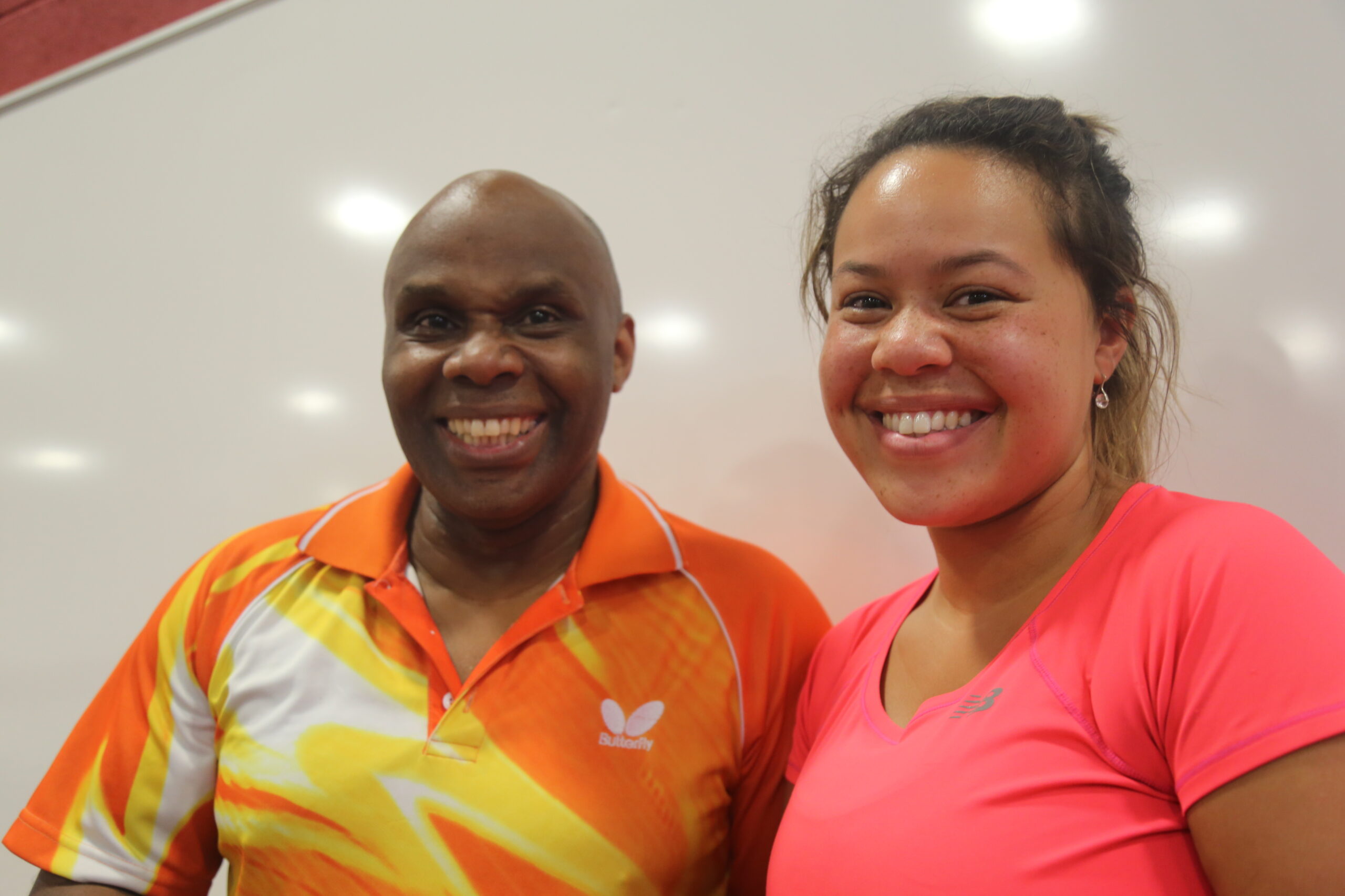 Dave Griffith and Rebekah Higgs -Rebekah Griffith- smiling as both won the 2019 Afro Caribbean table tennis tournament.