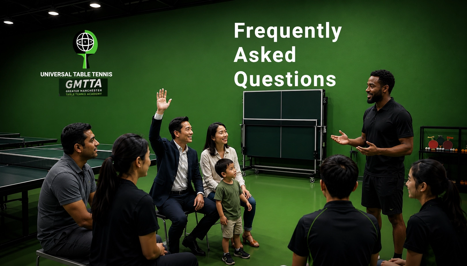 Coach Dave answering a parent's raised hand with a young child at Greater Manchester Table Tennis Academy by Universal TT.
